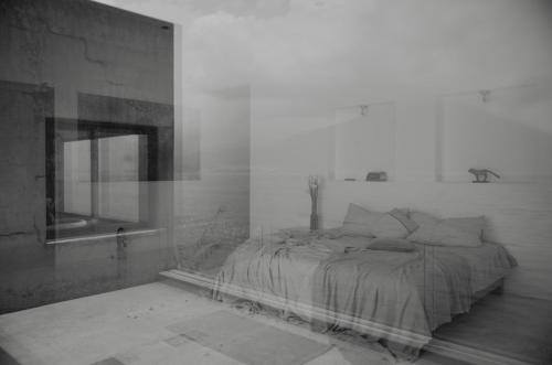 a black and white photo of a bedroom with a bed at Anzan Atitlan in San Marcos La Laguna