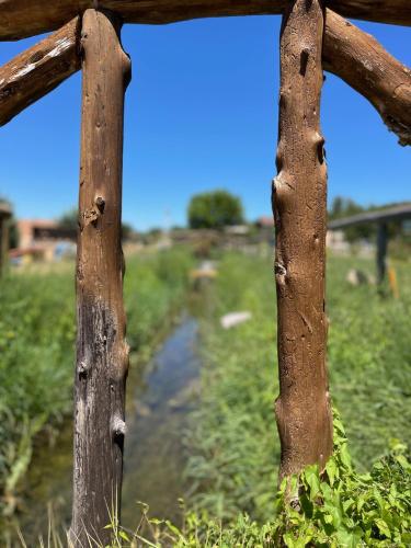 a fence with a river in the background at El BURGO DE OSMA ALOJAMIENTO RURAL VILLA BAGH in El Burgo de Osma