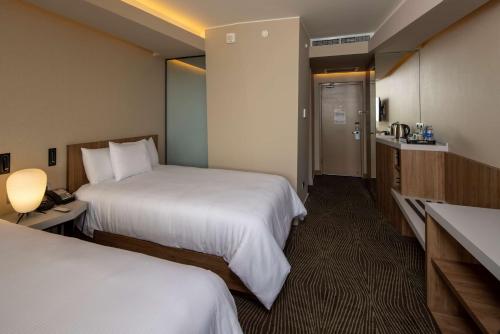 Postel nebo postele na pokoji v ubytování Hilton Garden Inn Lima Miraflores