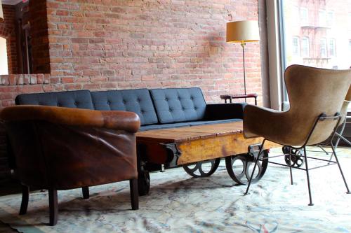 a living room with a couch and two chairs at Hotel on North in Pittsfield
