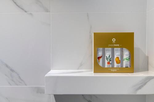 a box of products sitting on a shelf at NOS Suites in Ermoupoli