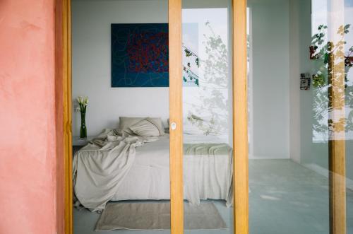a bedroom with a bed in a room at Anzan Atitlan in San Marcos La Laguna