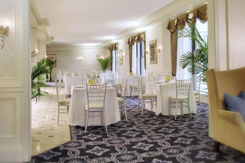 a banquet hall with white tables and chairs at The Drake Hotel in Chicago