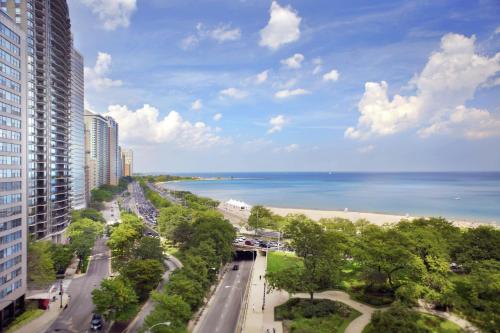 a view of a beach and the ocean from a building at The Drake Hotel in Chicago