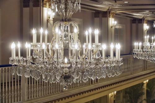 a chandelier hanging from a wall in a room at The Drake Hotel in Chicago