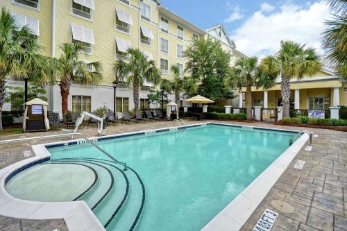 a swimming pool in front of a building at Homewood Suites by Hilton Charleston Airport/Convention Center in Charleston