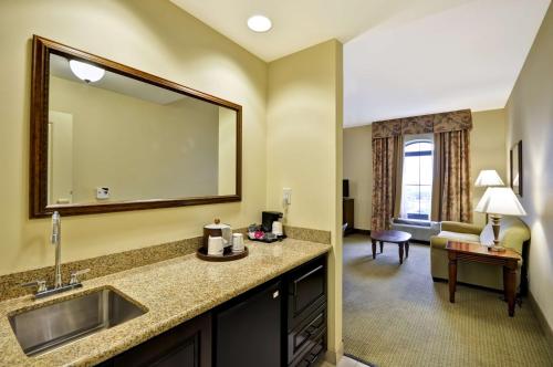 a hotel room with a sink and a mirror at Hampton Inn & Suites North Charleston-University Boulevard in Charleston