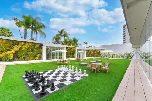 an outdoor chess board on the lawn of a house at The Beverly Hilton in Los Angeles