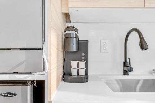 a kitchen with a sink and a faucet at Beautiful Lakeside Haven in Port Hope