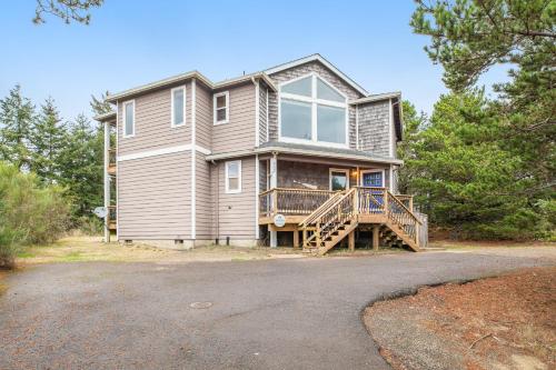 a large house with a porch and a driveway at Vista Azul in Oceanside