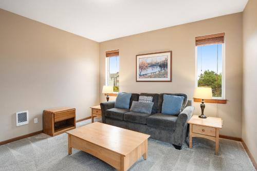 a living room with a couch and a table at Vista Azul in Oceanside
