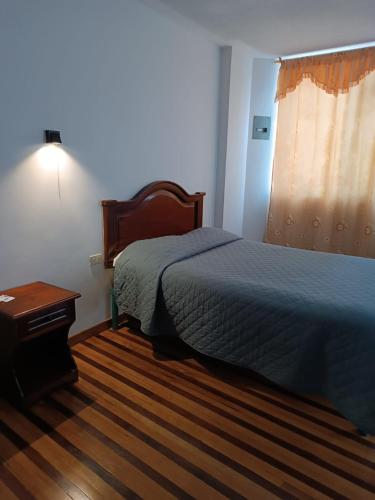 Uma cama ou camas num quarto em Hostal Pucará