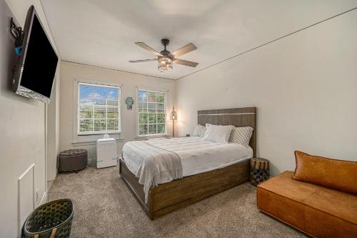 a bedroom with a bed and a ceiling fan at Mansion with Pub in Basement in Grosse Pointe Park
