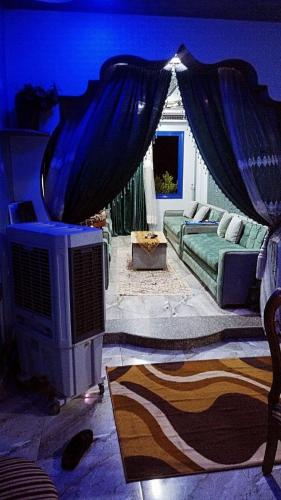 a bedroom with a bed with a blue ceiling at شقق للايجار 
