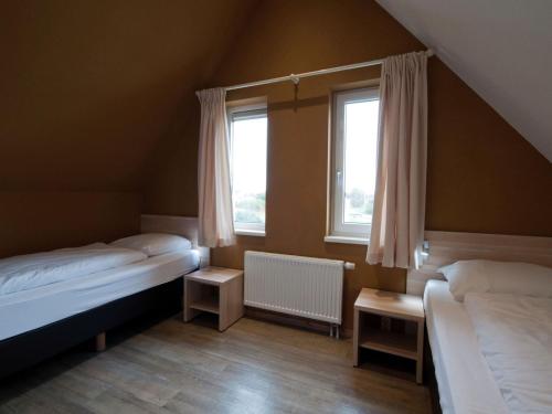 Postel nebo postele na pokoji v ubytování Villa in Texel with Luxurious Comfort