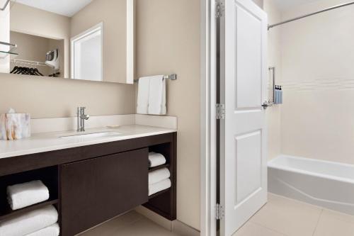 a bathroom with a sink and a shower at Residence Inn by Marriott Philadelphia Langhorne in Langhorne