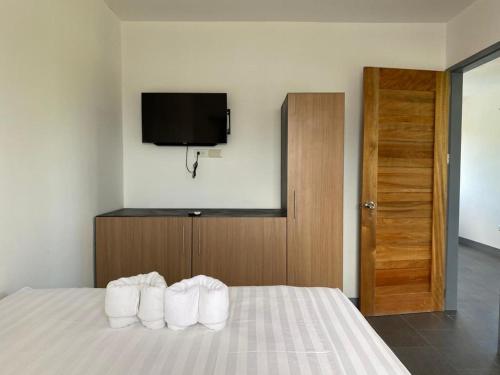 Ένα ή περισσότερα κρεβάτια σε δωμάτιο στο Malipaj Apartments