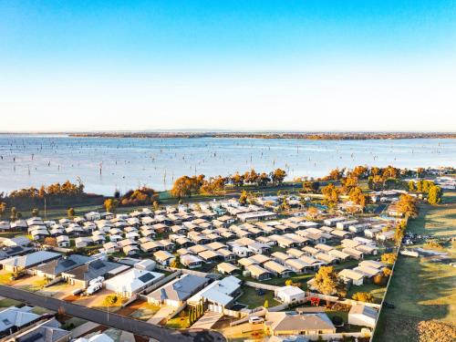 an aerial view of a parking lot next to the water at NRMA Yarrawonga Mulwala Holiday Park in Mulwala