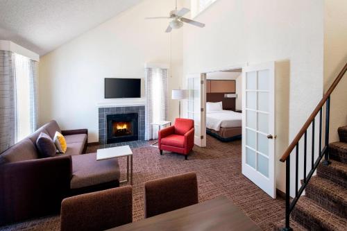 a living room with a couch and a fireplace at Residence Inn Los Angeles Torrance/Redondo Beach in Torrance