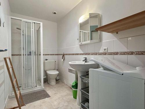 a bathroom with a sink and a toilet and a shower at Maison de village à St-Pierre-d'Oléron - 2 pièces, 3 couchages, centre, proche commerces et pistes cyclables - FR-1-246A-270 in Saint-Pierre-dʼOléron