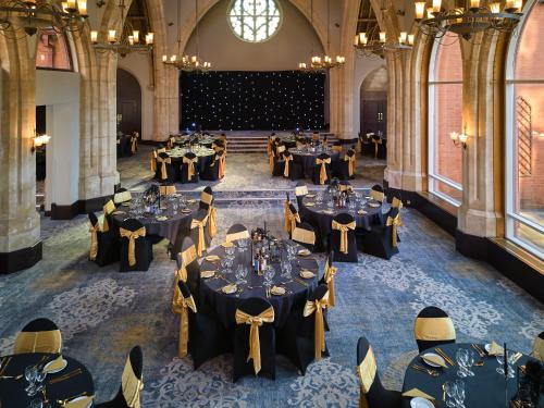 an overhead view of a banquet hall with tables at Holiday Inn Bolton Centre by IHG in Bolton
