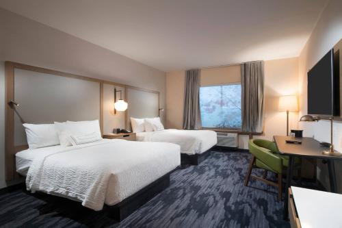 a hotel room with two beds and a window at Fairfield Inn & Suites by Marriott Tyler South in Tyler