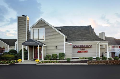 a house with a real estate sign in front of it at Residence Inn by Marriott Lexington North in Lexington