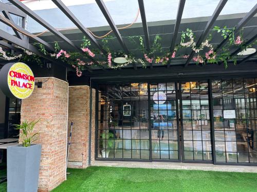 a store front with flowers hanging from the ceiling at DG Budget Hotel Salem in Manila