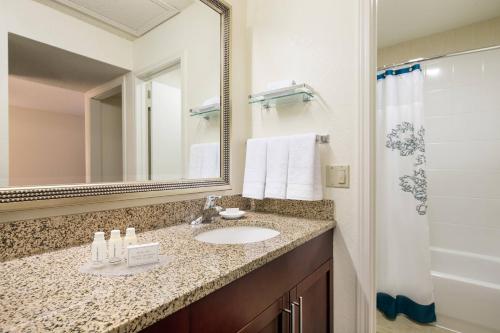 a bathroom with a sink and a mirror at Residence Inn San Diego La Jolla in San Diego
