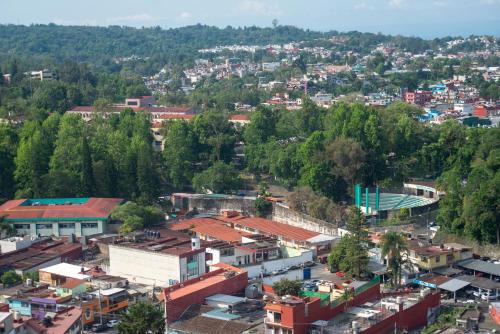 an overhead view of a city with buildings and trees at Holiday Inn Express Xalapa by IHG in Xalapa