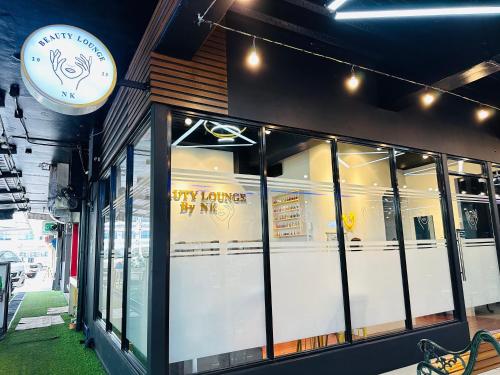 a store front with windows and a sign on the wall at DG Budget Hotel Salem in Manila