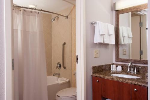 a bathroom with a sink and a toilet and a shower at Courtyard Miami Coral Gables in Miami