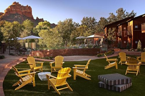 a group of chairs and tables on the grass at Amara Resort & Spa in Sedona