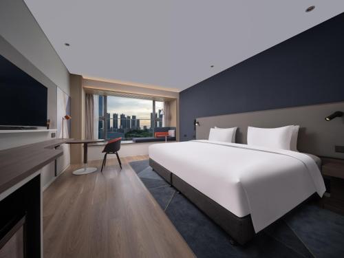 Postel nebo postele na pokoji v ubytování Holiday Inn Express Shenzhen Guangming Cloud Park by IHG