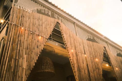 a building with a bunch of lights on it at U're Holitel in Haad Rin