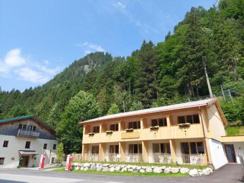 a building on the side of a mountain at Hotel Gasthof Klause Dependance 2 in Reutte