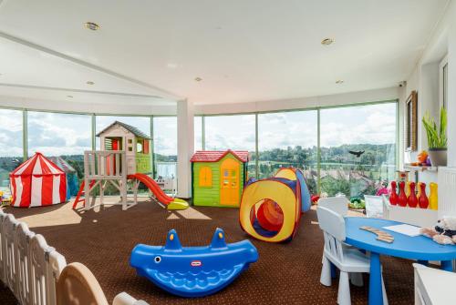 a play room with many different types of play equipment at Hotel Artur in Kraków