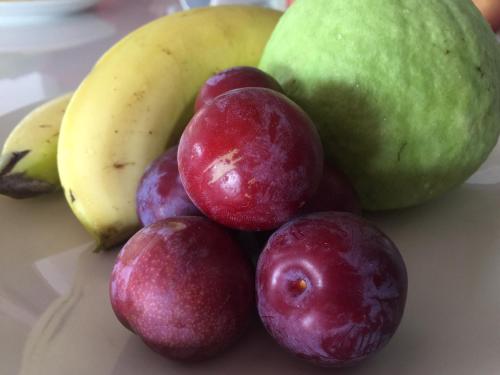 a pile of fruit sitting on top of a table at SunRise 23.5N B&B in Fenchihu