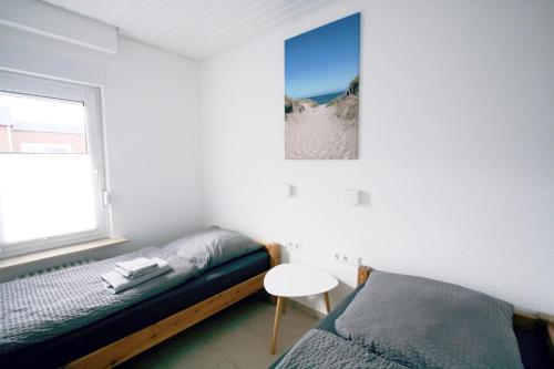 Ένα ή περισσότερα κρεβάτια σε δωμάτιο στο Ferienhaus Pelikanstr 78 Ostermann Bungalow 4