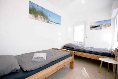 Postel nebo postele na pokoji v ubytování Ferienhaus Pelikanstr 129 Ostermann Bungalow 5
