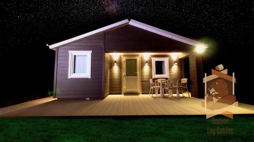 a small house with a deck at night at Glendaloch B&B in Antrim