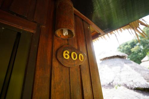 a wooden door with a number on it at Koh Jum Resort in Ko Jum