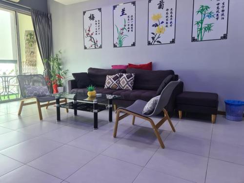 a living room with a couch and a table at Sekinchan SeaView Homestay 034 高楼看海阳台民宿 in Sekincan