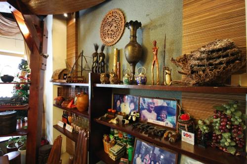 a room with a bunch of items on a shelf at Itathao Vacation Hotel in Yuchi