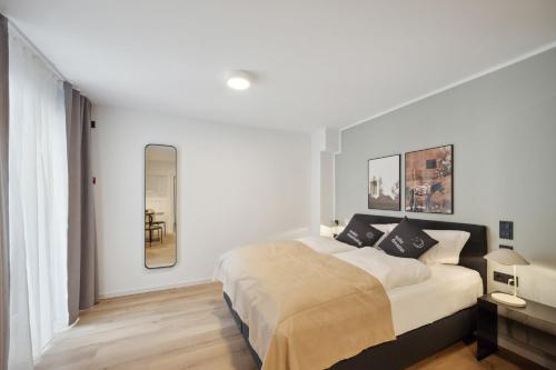 Ένα ή περισσότερα κρεβάτια σε δωμάτιο στο Limehome Nuremberg Celtisplatz