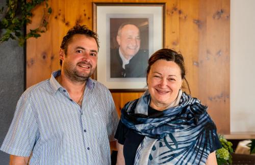 a man and a woman standing next to each other at Aparthotel Zum Schlössl in Villa Ottone