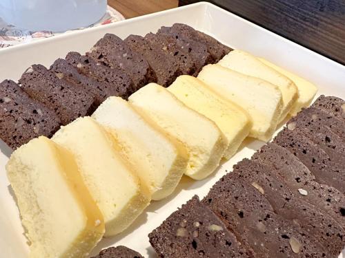 a plate of brownies and chocolate cookies on a table at Hotel Green Arbor in Sendai