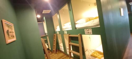 a group of bunk beds in a room at Wasabi Mita Hotel in Tokyo
