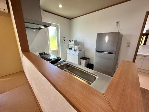 Cuisine ou kitchenette dans l'établissement 白浜貸別荘ss2-88