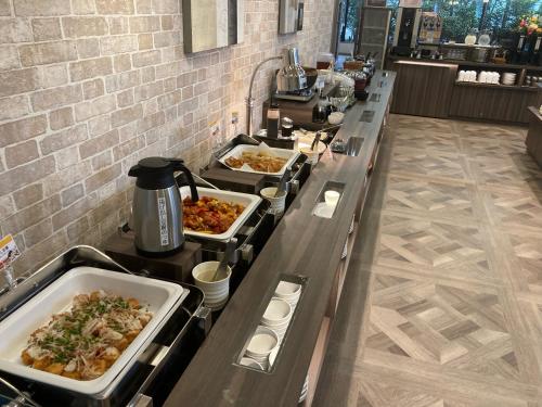 a buffet line with many different types of food at Hotel Route Inn Grand Nakano Obuse in Nakano